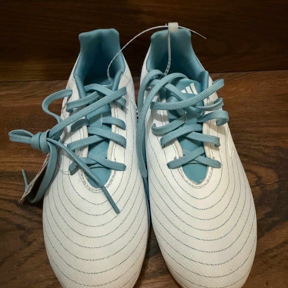 Adidas White cleats with Blue Highlights